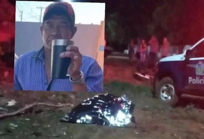 Corpo de Jair coberto aps ser morto com dois tiros (Foto: Jardim MS News)