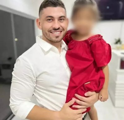 Marcelo Pimenta com a filha no colo; menina de 7 anos ainda n�o sabe da morte do pai, segundo a fam�lia (Foto: Reprodu��o)